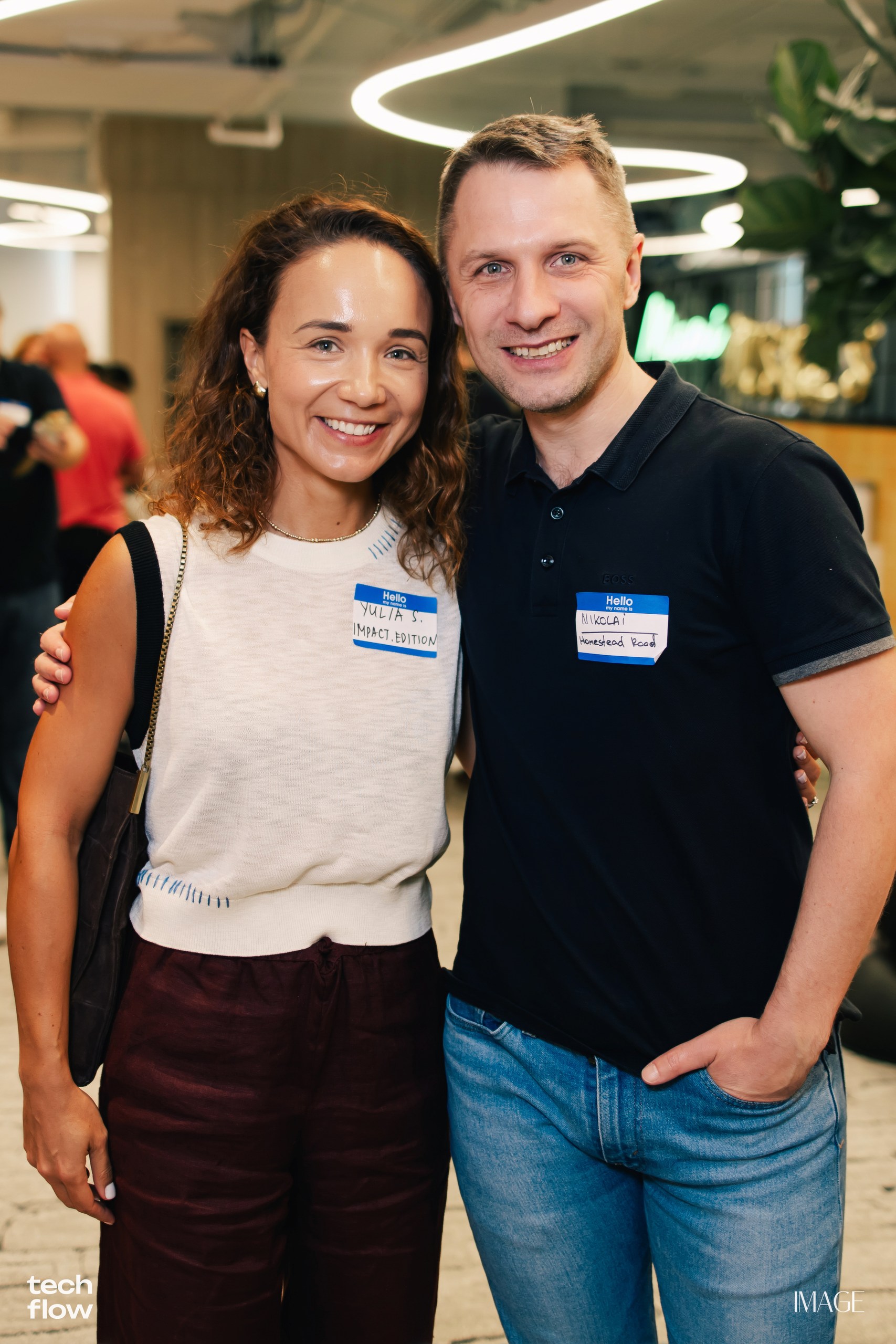 Yulia Strokova and Nikolai Strakh at Tech Flow Miami, March 2026 — her badge reads Impact.Edition.